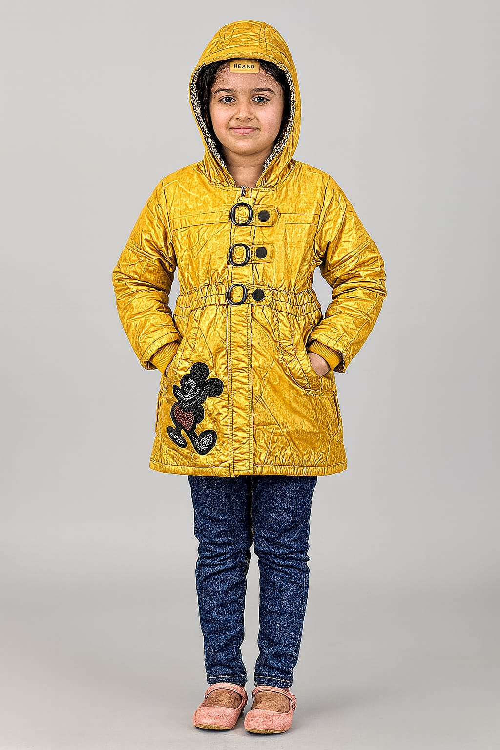 A stylish mustard yellow winter jacket designed for 7-year-old girls.